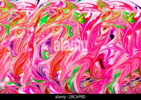 Coloratissime pitture liquide mescolate insieme che creano un astratto moderno. Illustrazioni. Foto Stock