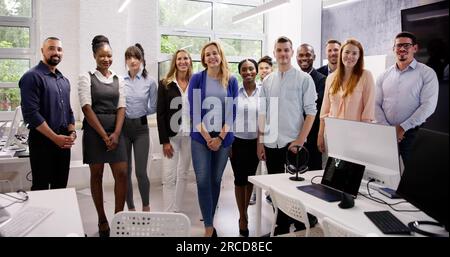 Happy Group of Business People Standing in Office Foto Stock