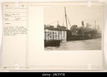 "Rimorchiatore che tira fuori la USS Huron da St. Porto di Nazaire, Francia. Questa foto, scattata il 4 gennaio 1919, raffigura la nave poco prima che salpasse per l'America con oltre duemila soldati a bordo. La foto è stata scattata dal fotografo Joseph L. Liles. Foto Stock