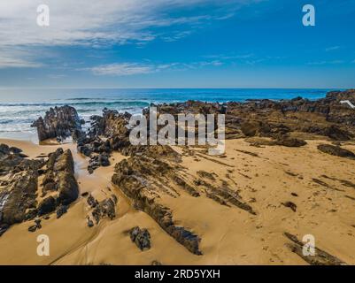 Esplorare Cuttagee Beach sulla costa della costa di Sapphire, nella costa meridionale del New South Wales, Australia Foto Stock