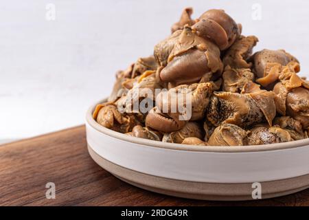 Molluschi commestibili frutti di mare Whelk rifilato Foto Stock