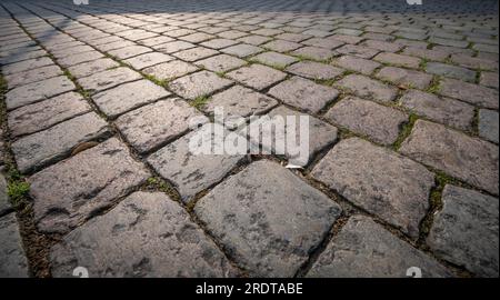 Ciottoli pavimentazione di pietra sullo sfondo Foto Stock