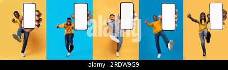 Felicissimi ragazzi multietnici che mostrano i telefoni mentre saltano su sfondi colorati Foto Stock