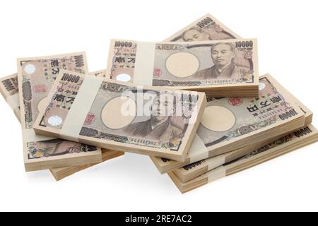 Pila di yen giapponesi. pacchetto di banconote da 10.000 yen. Le banconote sono scritte come "10.000 yen" in giapponese. Foto Stock