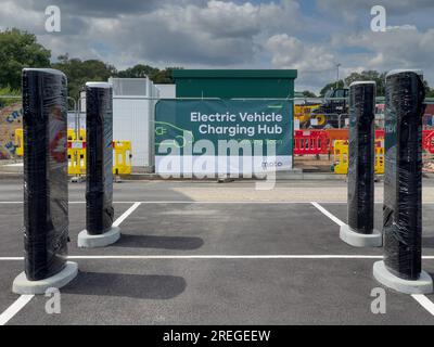 Stazione di ricarica per auto elettriche e avviso Foto Stock
