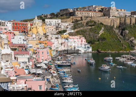 Panoramic view of Corricella port, the most famous touristic landmark of Procida, Campania region, Italy Foto Stock