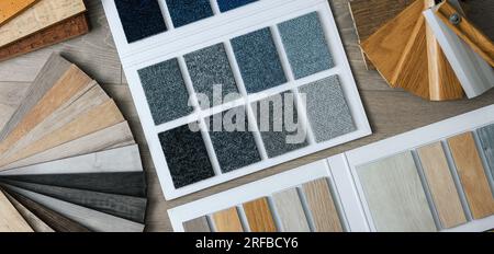 materiali per pavimentazioni e campioni di zoccoli. tappeto, laminato, vinile. vista dall'alto Foto Stock