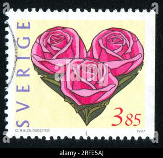 SVEZIA - CIRCA 1997: Timbro stampato dalla Svezia, mostra Love Stamp, circa 1997 Foto Stock