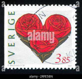 SVEZIA - CIRCA 1997: Timbro stampato dalla Svezia, mostra Love Stamp, circa 1997 Foto Stock