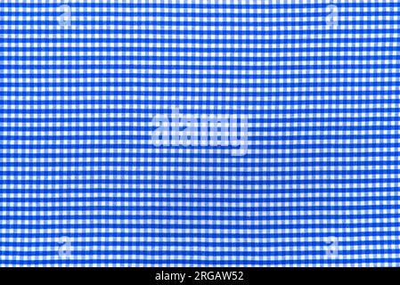 La consistenza del tessuto di lino in una grande cella di blu e bianco. Materiale sartoriale scozzese. tessuto a scacchi Foto Stock