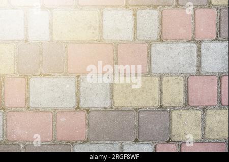 Superficie di lastre di pavimentazione multicolore. Splendido motivo, primo piano sullo sfondo Foto Stock