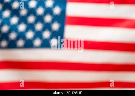 Bandiera americana come sfondo. Sfondo sfocato. Foto Stock