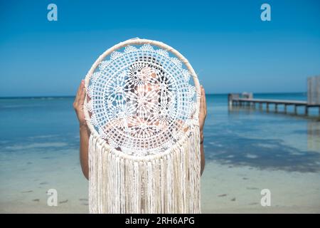 Woman holding a Macramé Stock Photo