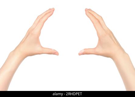 Le mani delle donne mostrano qualcosa in mano virtuale, su sfondo bianco in primo piano Foto Stock