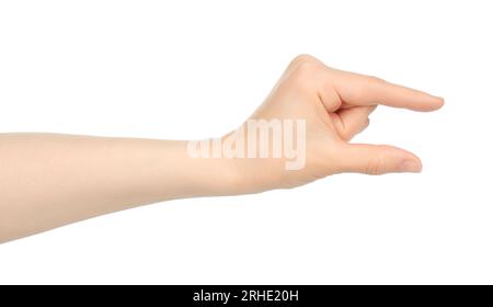 La mano di una donna mostra qualcosa in mano virtuale, in primo piano su sfondo bianco Foto Stock