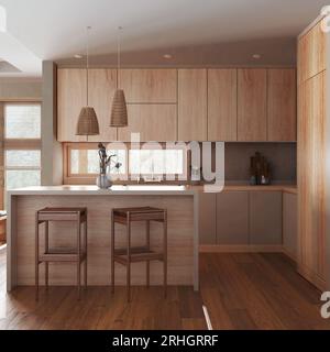 Cucina minimalista in tonalità di bianco e beige con isola e sgabelli. Armadi, elettrodomestici e decorazioni in legno. Design degli interni Japandi Foto Stock