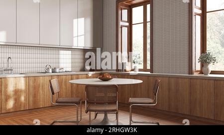 Cucina e sala da pranzo alla moda Japandi in toni bianchi e beige. Armadi in legno, tappezzeria contemporanea e finestra. Design degli interni minimalista Foto Stock