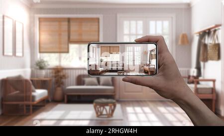 Smartphone con impugnatura, applicazione AR, simulazione di mobili e prodotti di interior design in una casa reale, concetto di architetto designer, vita in agriturismo Foto Stock