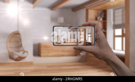 Smartphone con impugnatura, applicazione AR, simulazione di mobili e prodotti di interior design in una casa reale, concetto di architetto designer, sfocatura sfondo, j Foto Stock
