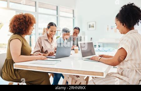 Fashion, designer and group of women on laptop, planning or brainstorming project in startup office. Tailor teamwork, collaboration and computer of Foto Stock