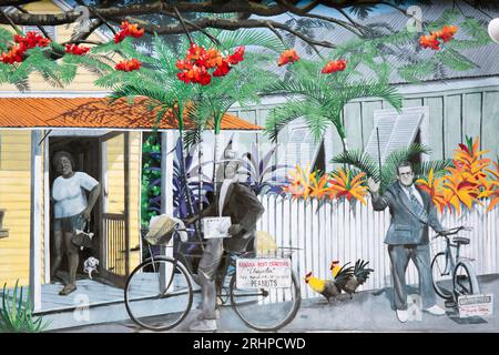 Key West, Florida, USA. Colorato murale di Rick Worth che raffigura una tipica scena locale, il villaggio di Bahama, la città vecchia. Foto Stock