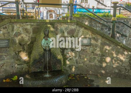 Malvhina, is a female figure sculpted in stone and bronze located on Belle Vue Island in Great Malvern by Rose Garrard. Stock Photo