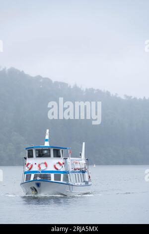 Windermere boat ride on the lake during raining, Lake district, UK Stock Photo