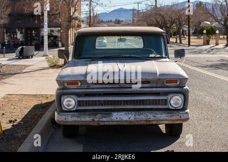 Clarkdale, Arizona, USA - January 3, 2022: Morning light shines on a vintage truck parked in historic downtown Clarkdale. Stock Photo