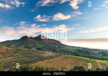 Sunset of Helderberg Mountains with wine farms in Stellenbosch area South Africa Stock Photo