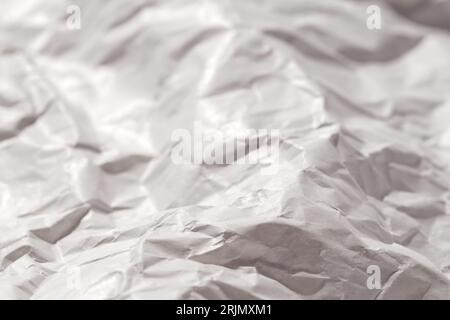 Plain white grunge crumpled paper. Blank gray adhesive paper or sticker label with wrinkled and creased effect. Stock Photo
