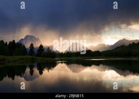 This is a view of storm clouds over the Oxbow Bend area of the Snake River in Grand Teton National Park, Wyoming, USA.. Mt. Moran is on the far left. Stock Photo