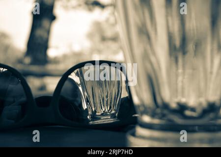 Draft beer and sunglasses in the park, Black and White, Vysehrad, Prague, Czech Republic Stock Photo