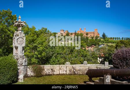 View of the Pontifical University of Comillas from the palace of Sobrellano, with clear blue skies. Stock Photo