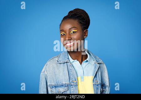 Portrait of beautiful young black lady in stylish casual outfit Foto Stock