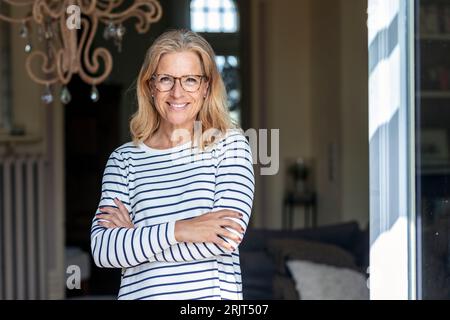 Ritratto di sorridere donna matura con gli occhiali Foto Stock