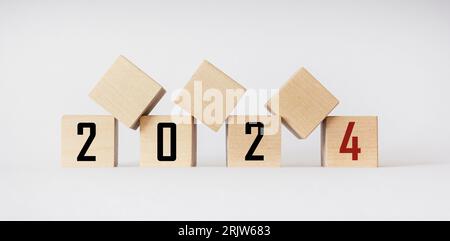Wooden blocks of 2024 on a white background. Start new year 2024 with goals plan, goal concept, action plan, strategy, new year business vision. Stock Photo