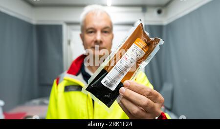 PRODUCTION - 23 August 2023, Lower Saxony, Dethlingen: Klaus Hammer, emergency physician, holds the drug 'DuoDote' in his hand as an auto-injector against nerve agents. Chemical weapons originating from the Wehrmacht are now to be recovered from the Dethlingen pond. The pond was filled in after the Second World War. More than 100,000 different weapons are said to be in the ten to twelve meter deep pond. An investigation of a neighboring groundwater body had revealed massive contamination with explosive ordnance degradation products. During the subsequent reconnaissance of the pond between Sept Stock Photo