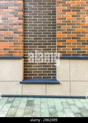 red brick wall with niche. renovated old industrial building detail. Stock Photo