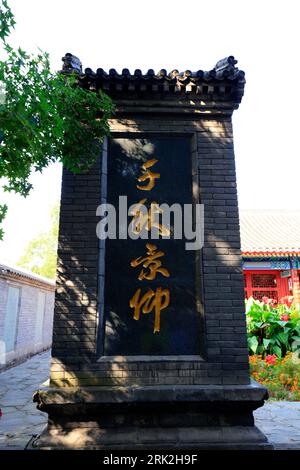 Qinhuangdao City, China - October 4, 2018: The Chinese character 'admiration for thousands of years' is carved on the stone tablet in laolongtou sceni Stock Photo