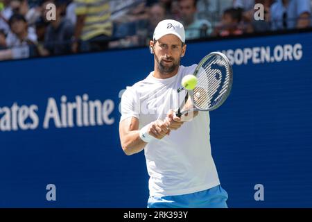 Novak Djokovic of Serbia returns ball during practice for US Open Championship at Billy Jean King Tennis Center in New York on August 23, 2023 Stock Photo