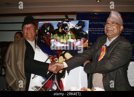 Bildnummer: 53622502  Datum: 23.11.2009  Copyright: imago/Xinhua (091124) -- KATHMANDU, Nov. 24, 2009 (Xinhua) -- Nepalese Prime Minister Madhav Kumar Nepal (R) felicitates Min Bahadur Sherchan, in Kathmandu, capital of Nepal, Nov. 23, 2009. Min Bahadur Sherchan has officially replaced in the Guinness Book of World Records as the oldest man to climb Mt Qomolangma (also Mt Everest), a press meet said on Monday. The certificate handed to Sherchan by the Guinness World Records says, The oldest man to climb Mt Everest is Min Bahadur Sherchan (Nepal b.20 June 1931) who reached the summit on 25 May Stock Photo