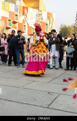 A performer wearing traditional clothing during the Lok Mela festival in Islamabad, Pakistan Stock Photo