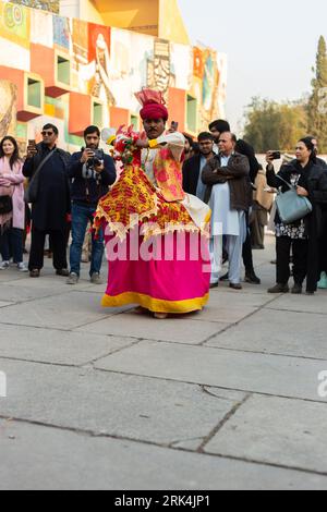 A performer wearing traditional attire during the Lok Mela festival in Islamabad, Pakistan Stock Photo