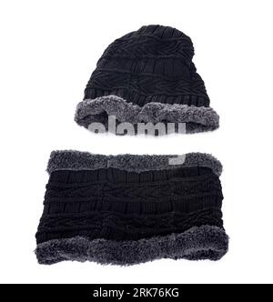 scarf and wolly hat in front of white background Foto Stock