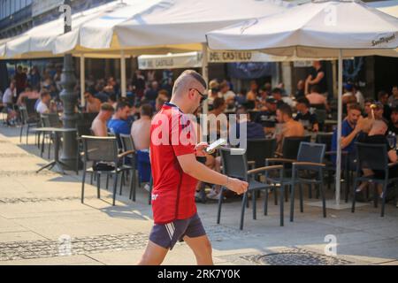 Pamplona, Spain, 24th, August, 2023: A CA Osasuna fan walks past the Club Brugge supporters during the preview of the UEFA Conference League preliminary round first leg match between CA Osasuna and Club Brugge in Pamplona, Spain, on August 24, 2023. Credit: Alberto Brevers / Alamy Live News. Stock Photo