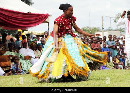 A Sango deity worshipper from Oyo kingdom performs at the World Sango Festival which is an annual festival held among the Yoruba people in honor of Sango, a thunder and fire deity who was a warrior and the third king of the Oyo Empire after succeeding Ajaka his elder brother. The festival plays host to visitors from all over the country and followers from foreign countries. Oyo state, Lagos, Nigeria. Stock Photo