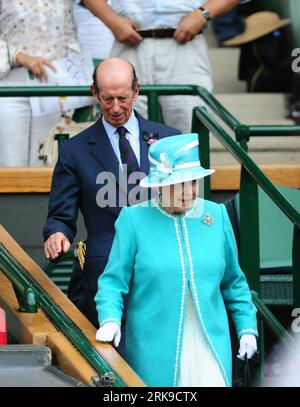 LONDON, June 24, 2010 (Xinhua) -- The Queen Elizabeth II and Prince Edward, Duke of Kent arrive at the Royal Box of the Centre Court of All England Club where the 2010 Wimbledon Championships is being held, in London, Britain, June 24, 2010. It is the first time for the Queen to visit the All England Club in 33 years. (Xinhua/Zeng Yi)(dl) BRITAIN-LONDON-TENNIS-WIMBLEDON OPEN-QUEEN PUBLICATIONxNOTxINxCHN   London June 24 2010 XINHUA The Queen Elizabeth II and Prince Edward Duke of Kent Arrive AT The Royal Box of The Centre Court of All England Club Where The 2010 Wimbledon Championships IS Bein Stock Photo