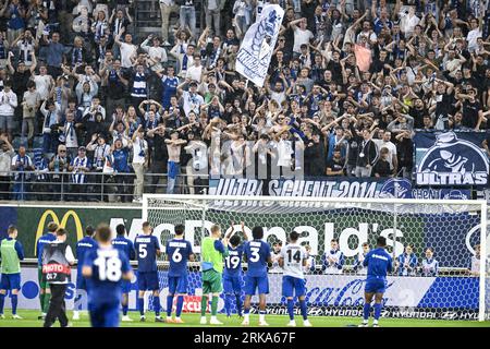 Gent, Belgium. 24th Aug, 2023. Gent's supporters celebrate after winning a soccer game between Belgian KAA Gent and Cypriot APOEL FC Nicosia, Thursday 24 August 2023 in Gent, the first leg of the play-offs for the UEFA Europa Conference League competition. BELGA PHOTO TOM GOYVAERTS Credit: Belga News Agency/Alamy Live News Foto Stock