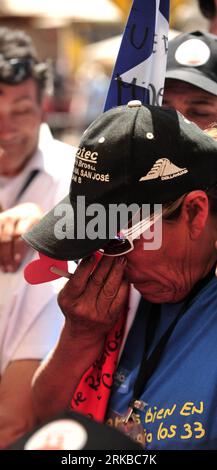 Bildnummer: 54534211  Datum: 13.10.2010  Copyright: imago/Xinhua (101014) -- SAN JOSE, Oct. 14, 2010 (Xinhua) -- A relative of trapped miner Dario Segovia reacts as he watches the rescue on TV at the Camp Hope of the San Jose mine near Copiapo, Chile, Oct. 13, 2010. The 33 miners trapped in the collapsed mine is being brought to the surface one by one as the final stage of the 69-day rescue operation continues. (Xinhua/Jorge Villegas) (zw) CHILE-MINE ACCIDENT-RESCUE-RELATIVES PUBLICATIONxNOTxINxCHN Gesellschaft Chile San Jose Mine Bergbau Grubenunglück Rettung Bergleute Bergung kbdig xub 2010 Stock Photo