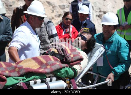 Bildnummer: 54534228  Datum: 13.10.2010  Copyright: imago/Xinhua (101014) -- SAN JOSE, Oct. 14, 2010 (Xinhua) -- In this image released by the government of Chile, the fifteenth miner Victor Segovia is taken to hospital after being brought to the surface at the San Jose mine in Copiapo, Chile, Oct. 13, 2010. The operation to lift out the 33 miners trapped for over two months in northern Chile is under way right now. (Xinhua/ Hugo Pineda/ Government of Chile) MANDATORY CREDIT NO SALES EDITORIAL USE ONLY CHILE-MINE ACCIDENT-RESCUE-MINERS PUBLICATIONxNOTxINxCHN Gesellschaft Chile San Jose Mine Be Stock Photo